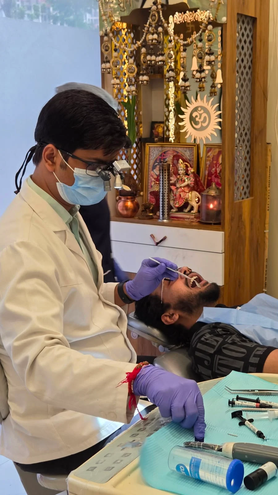 Dentist treating a patient in the clinic chair